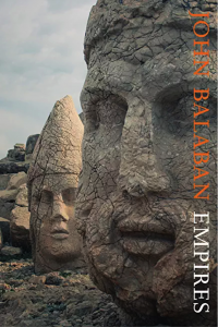 Empires cover - stone carvings of heads approximately 10 feet tall